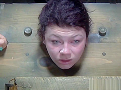 Restrained sub whipped while anally hooked